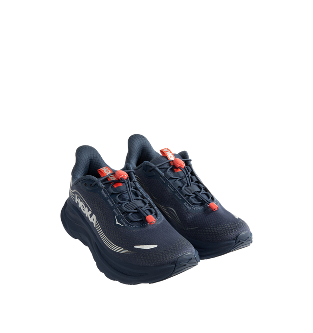 Image 2 of 5 - NAVY - Hoka Women's Clifton 11 GTX Running Sneakers feature a closed-mesh upper with a GORE-TEX Invisible Fit membrane and PFC-free water-repellent treatment. An adjustable speed-lace system with toggle, reflective details, a compression-molded EVA midsole, and a Durabrasion rubber outsole with forefoot traction pods complete the weather-ready design. Upper: Mesh with GORE-TEX Membrane. Midsole: EVA Foam. Sole: Rubber. Heel-to-Toe Drop: 8 mm. 