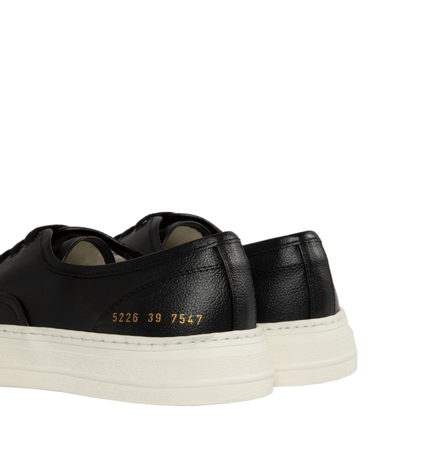 Image 3 of 5 - BLACK - Common Projects Four Hole Lace-Up Sneakers in a low-top design with flat sole, front lace-up fastening, round toe detailed with signature gold number stamp at the heel. Made in Italy. 