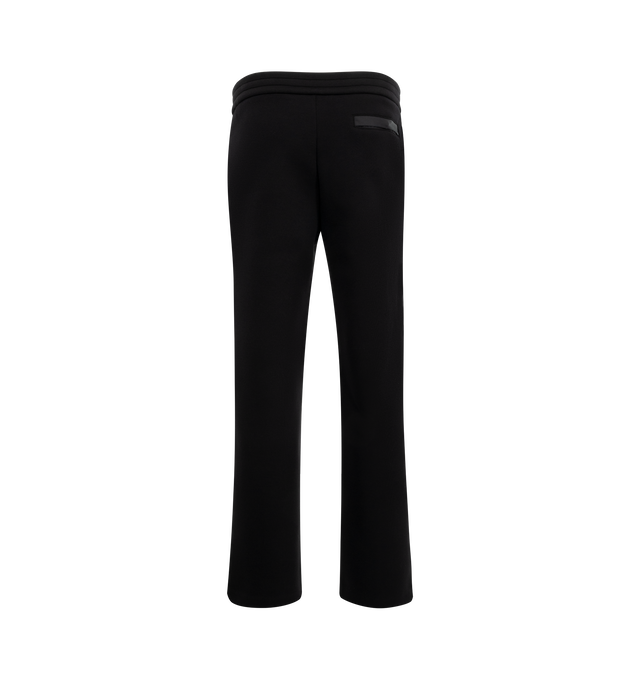 Image 2 of 3 - BLACK - Moncler Logo Cotton and Neoprene Sweatpants have an elastic drawstring waistband, front pleats, side pockets, a silicone logo patch, and a snap button back pocket. 55% cotton, 45% polyester. Made in Turkey.  