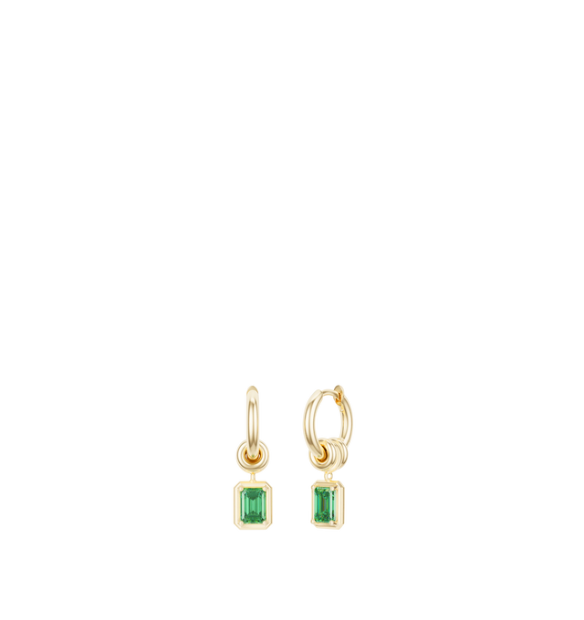 Image 1 of 1 - GREEN - Spinelli Kilcollin Zahra Emerald Cut Earrings are crafted from 18k yellow gold and feature a streamlined hoop silhouette accented with three signature annulets on each earring. The center annulet supports a drop charm set with an emerald-cut emerald, adding color, movement, and contrast to the design. Finished with comfortable hoop closures, each pair is individually handcrafted in Los Angeles. Main Material: 18k Yellow Gold. Stone: Emerald-Cut Emerald. Details: Three Signature Annule 
