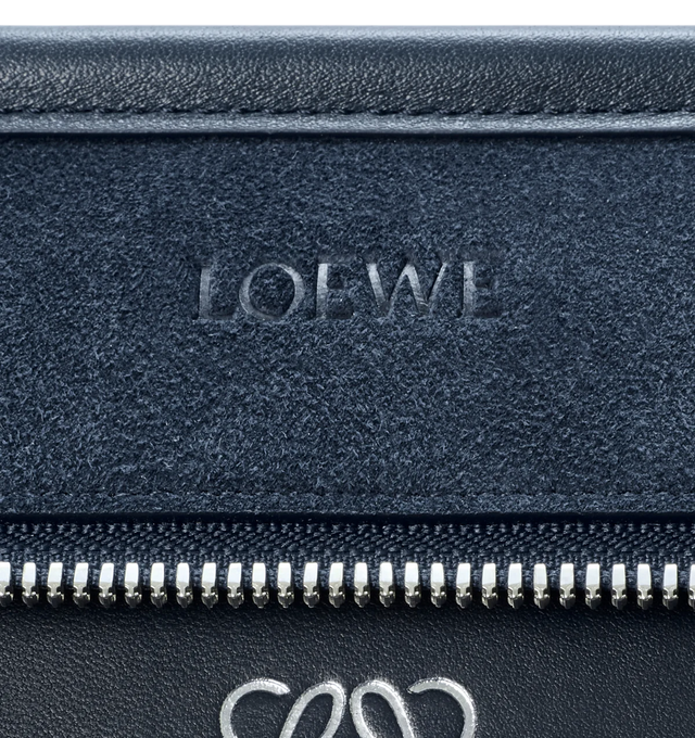 Image 14 of 16 - NAVY - Loewe Large Amazona 180 Bag in suede featuring a relaxed silhouette anchored by a single toron top handle, designed to be carried open while a concealed closure secures the main compartment, removable shoulder and crossbody straps, zip closure with two leather zip pullers, two compartments, main compartment closed with magnetic closure, internal flat pocket, left side d-ring for customization, suede and nappa lambskin lining, embossed LOEWE and embossed double L branding. Suede/calf. 