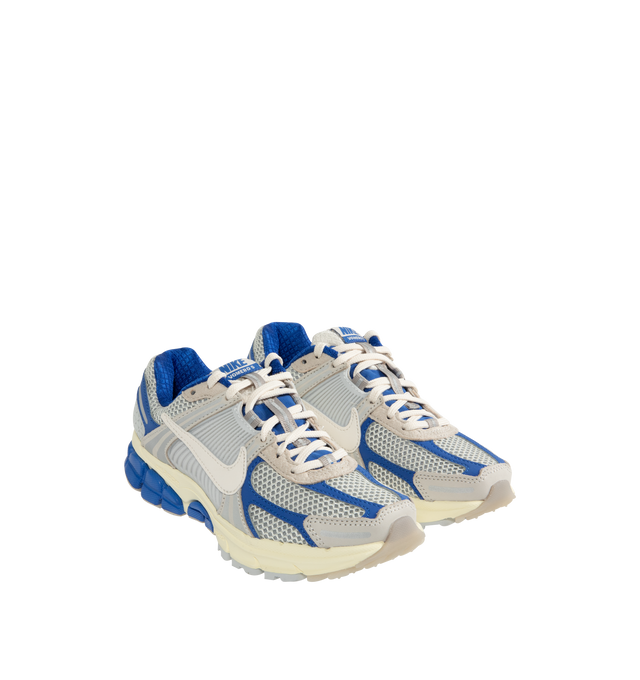 Image 2 of 5 - BLUE - NIKE Zoom Vomero 5 Sneaker featuring real and synthetic leather on upper, mesh panels and ventilation ports on heel, Air Zoom cushioning, plastic caging on side, rubber outsole and reflective details. 