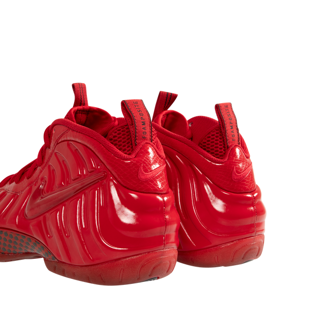 Image 3 of 5 - RED - NIKE Air Foamposite Pro Sneaker featuring Foamposite upper that molds to your foot, full-length and heel Zoom Air cushioning, foam midsole and rubber outsole with herringbone tread. 