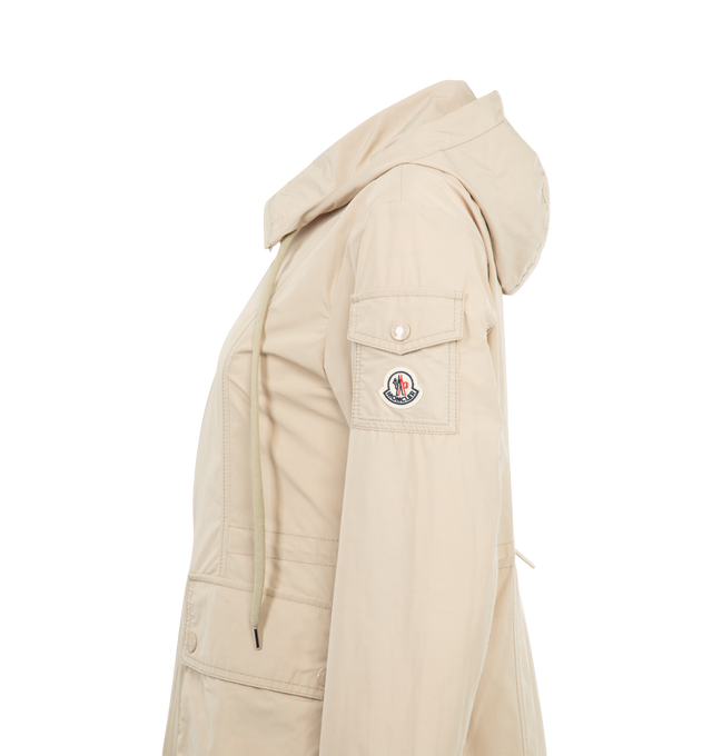 Image 3 of 3 - NEUTRAL - MONCLER Leandro Parka featuring adjustable hood, zipper closure, patch pockets with snap button closure, sleeve pocket and waistband with drawstring fastening. 60% polyester, 40% cotton. 