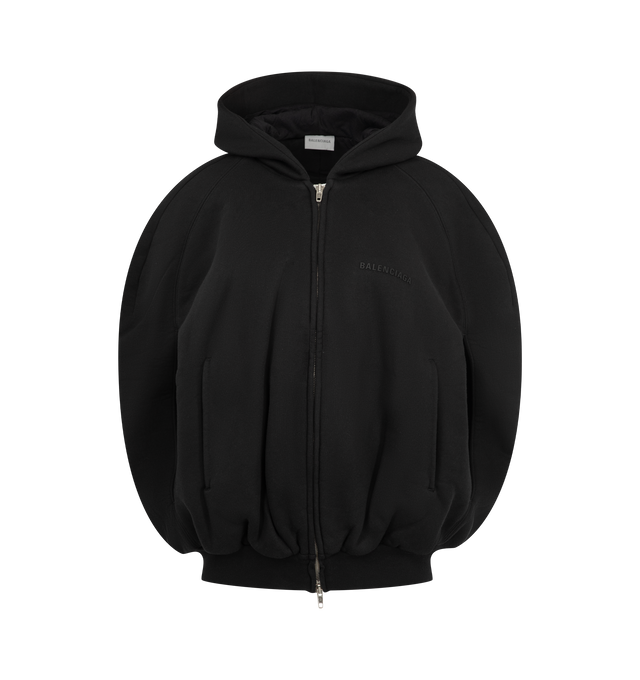 Image 1 of 2 - BLACK - Balenciaga Women's Balloon Cape Hoodie is crafted from heavy fleece and features an attached hood, dropped shoulders, and a distinctive cape-effect silhouette. Designed with a double-ended zip closure and two front arm openings, this oversized style is finished with a printed Balenciaga logo at the front and ribbed detailing at the waistline. Main Material: 100% Cotton. Lining: 100% Cotton. Filling: 100% Polyester. Made in Portugal. 