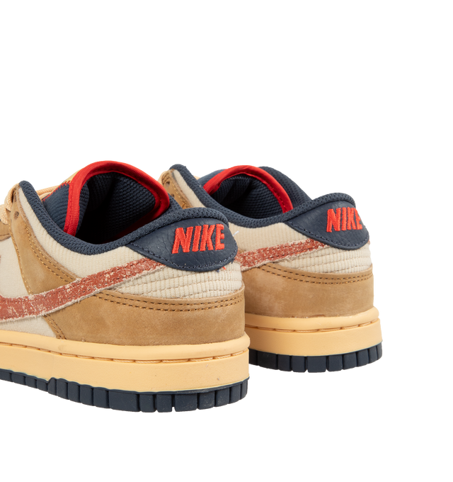 Image 3 of 5 - NEUTRAL - Nike Dunk Low Sneakers with Wheat, Burnt Sunrise and Sanddrift color-blocking,  a padded, low-cut collar, leather upper with a slight sheen and durability, foam midsole offering lightweight, responsive cushioning. Perforations on the toe add breathability. Rubber sole with classic hoops pivot circle provides durability and traction. 