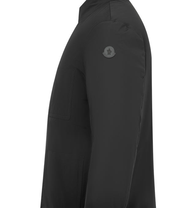 Image 4 of 5 - BLACK - MONCLER Ouille Reversible Short Down Jacket featuring aquaflect, water-repellent main fabric, Airsoft lining, reversible, down-filled, zip and snap button closure, side pockets, inner pockets with zip and snap button closure and leather logo patch. 100% polyester. Padding: 90% down, 10% feather. Made in Romania. 