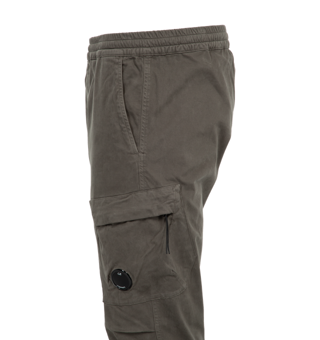 Image 3 of 3 - GREEN - C.P. COMPANY Stretch Sateen Ergonomic Lens Single Cargo Pants featuring adjustable drawstring waistband, side pockets, cargo flap and hidden zip pocket with Lens detail, back flap pocket with embroidered logo patch, garment dyed and ergonomic fit. 98% cotton, 2% elastane/spandex. 