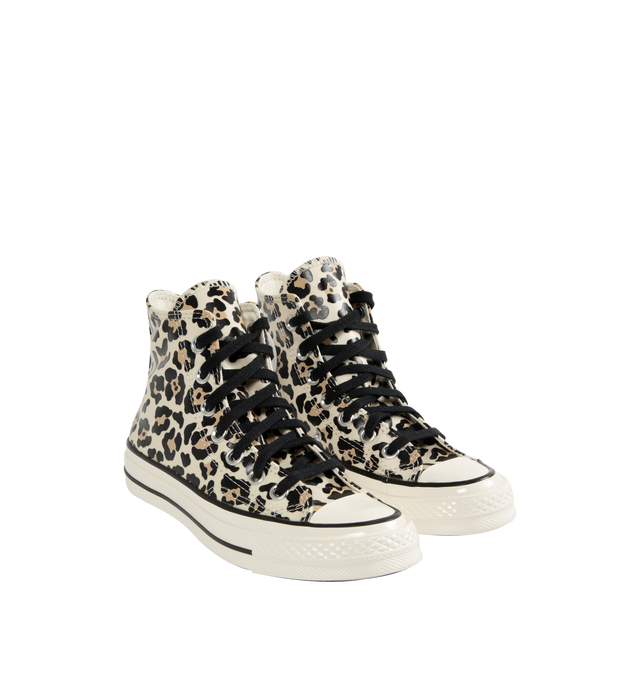 Image 2 of 5 - MULTI - Converse retro animal print Chuck 70 high top lace-up sneaker glows in the dark. Featuring timeless canvas upper, OrthoLite cushioning providing optimal comfort, black flat lace ties, Iconic Chuck Taylor patch. Unisex style in men's sizes. This styel runs large- order 1 size down. 