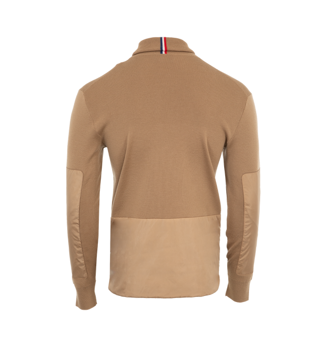 Image 2 of 3 - NEUTRAL - MONCLER Wool Turtleneck Sweater has a turtleneck, rainwear patches, signature logo, zipper ski pass pocket, and wrist gaiters. Polyester and nylon.  