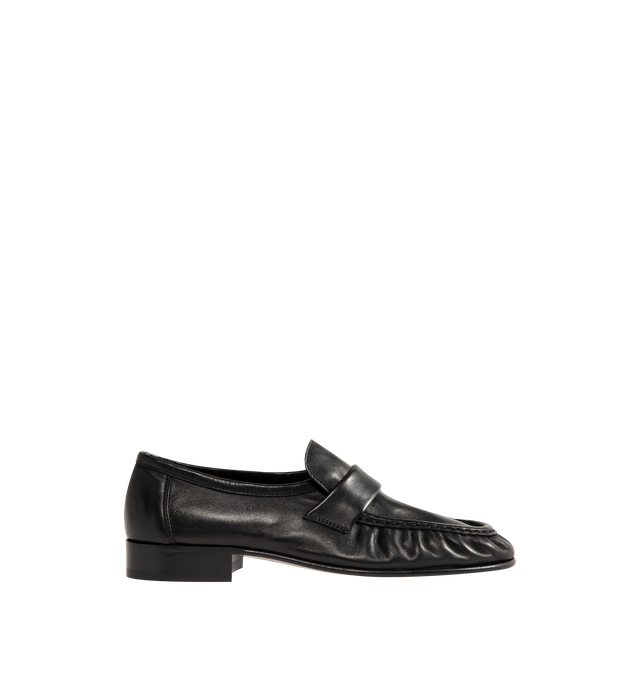 Image 1 of 4 - BLACK - The Row womne's artisanally-crafted loafer in soft nappa leather with natural pleating effect and hand-painted leather sole. 0.75 in. heel. 100% Lambskin Leather. Made in Italy. 