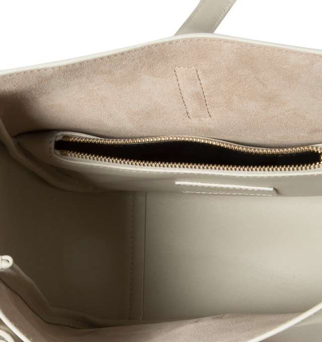 Image 3 of 5 - WHITE - SAINT LAURENT  Le A 7 Soft Small has a metal Cassandre hook closure, bronze-tone hardware, and interior zip pocket. Suede lining. 100% calfskin leather. Dimensions: 9 X 8.7 X 3.5 inches.  Made in Italy.  