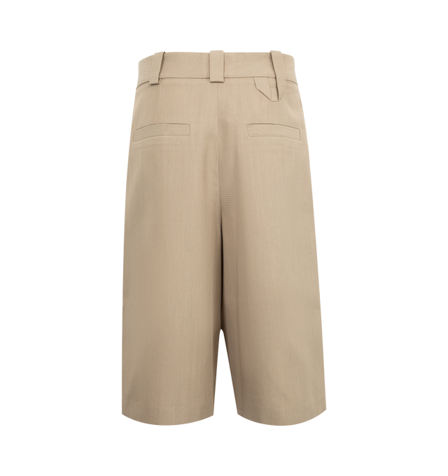 Image 2 of 4 - BROWN - JACQUEMUS Pleated Bermuda Shorts featuring wide, high-rise bermuda cut, twill fabric, wide belt loops with "J" loop on the back, pressed pleats, hidden zip closure with hook and button, slant pockets and two welt pockets on back. 63% polyester, 37% virgin wool. Lining: 97% cotton, 3% elastane. Made in Bulgaria. 