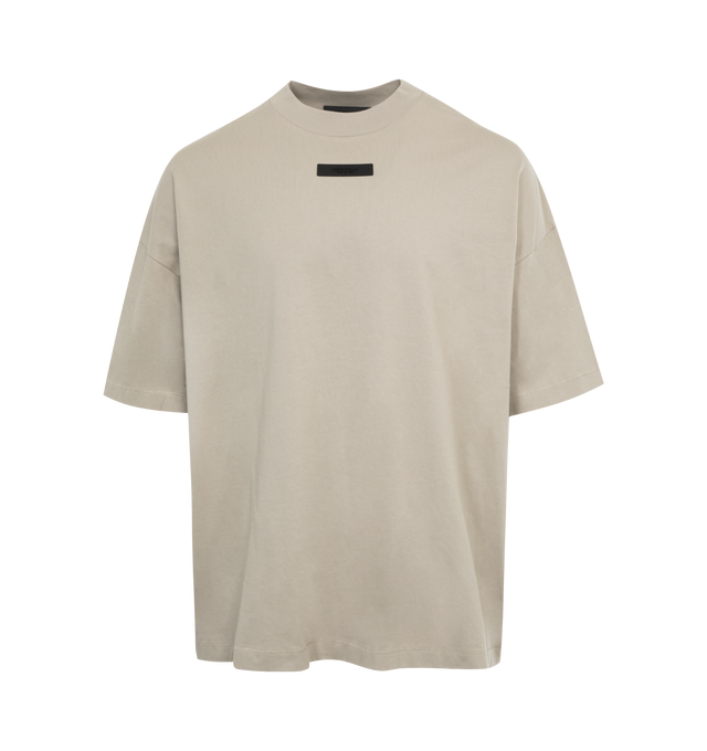 Image 1 of 2 - GREY - FEAR OF GOD ESSENTIALS Crewneck T-Shirt featuring rib knit crewneck, rubberized logo patch at chest and back, dropped shoulders and dolman sleeves. 100% cotton. Made in Viet Nam. 