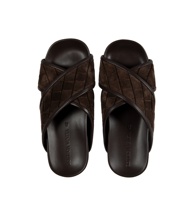 Image 4 of 4 - BLACK - BOTTEGA VENETA Tarik Intrecciato Suede Slide Sandals featuring signature woven intreccio suede with leather piping, flat heel, open toe, crisscross vamp, easy slide style and molded comfort footbed. Made in Italy. 