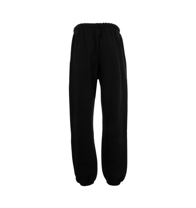 Image 2 of 3 - BLACK - Fear of God Fleece Sweatpants have an elastic drawstring waist, side seam pockets, elastic hems, and logo details. 83% cotton, 17% recycled polyester fleece.  