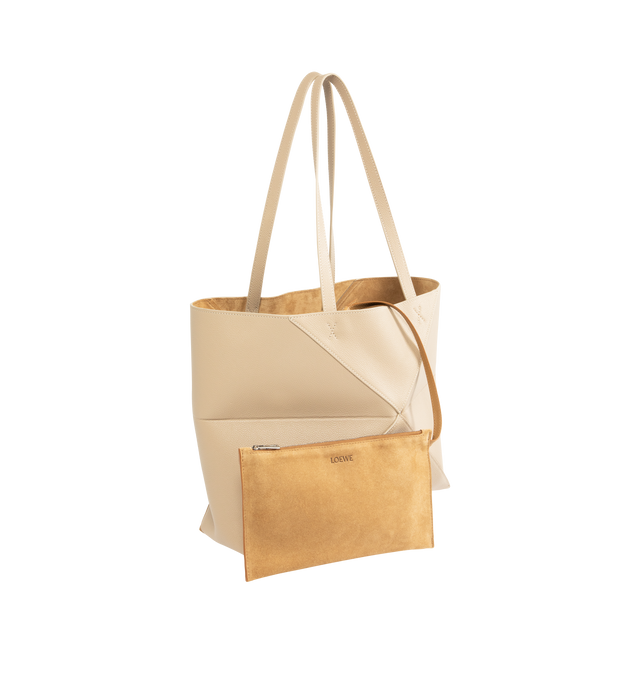 Image 2 of 3 - CHAMPAGNE - LOEWE Medium Horizontal Puzzle Fold Tote in soft grained calfskin featuring a lightweight geometric structure designed to fold completely flat, shoulder or hand carry, detachable inside zipped suede pocket, suede lining and gold embossed LOEWE. Soft grained calf. Strap drop: 27 cm. 29 cm x 31.5 cm x 12.5 cm. Made in Spain. 