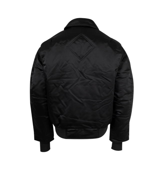 Image 2 of 3 - BLACK - CANADA GOOSE Seguin Aviator Bomber featuring double placket with coin-snap closure, dropped shoulders, rib-knit cuffs and hem, interior backpack straps for hands-free carrying capabilities, two fleece-lined zippered hand pockets, one sleeve pocket, one pen pocket with snap closure and ribbed waist. 100 % recycled polyamide. Made in Canada. 