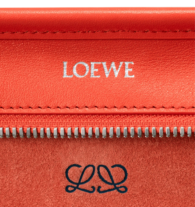 Image 15 of 17 - ORANGE - Loewe Small Amazona 180 Bag in leather features a relaxed silhouette anchored by a single toron top handle, designed to be carried open, while a concealed closure secures the main compartment, three carry options: short handle, removable shoulder strap and crossbody, zip closure with two leather zip pullers, two compartments, main compartment closed with magnetic closure, internal flat pocket, left side d-ring for customization, nappa lambskin lining, and embossed double L branding 