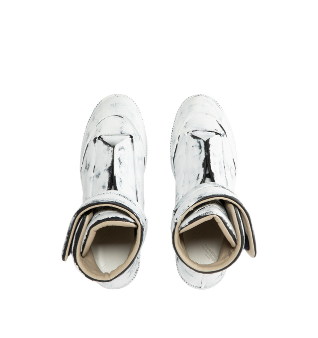 Image 5 of 5 - WHITE - MAISON MARGIELA Future Sneaker Bianchetto featuring calfskin, upper and sole are finished with our Bianchetto technique, white paint brushed across the surface to reveal the black leather beneath at the edges, hidden strap folds across the tongue and signature white stitch at the back. 