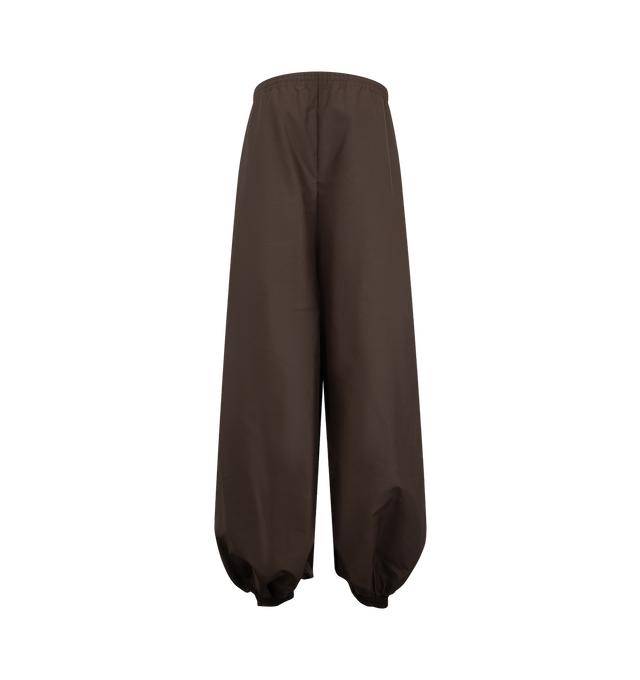 Image 2 of 3 - BROWN - Balenciaga Women's Balloon Tracksuit Pant is crafted from nylon and features the brand's signature balloon silhouette with an exaggerated, voluminous shape. Designed with a relaxed fit and sportswear-inspired construction, these statement track pants combine technical fabrication with Balenciaga's avant-garde proportions for a modern, oversized look. Main Material: Nylon. Made in Italy. 