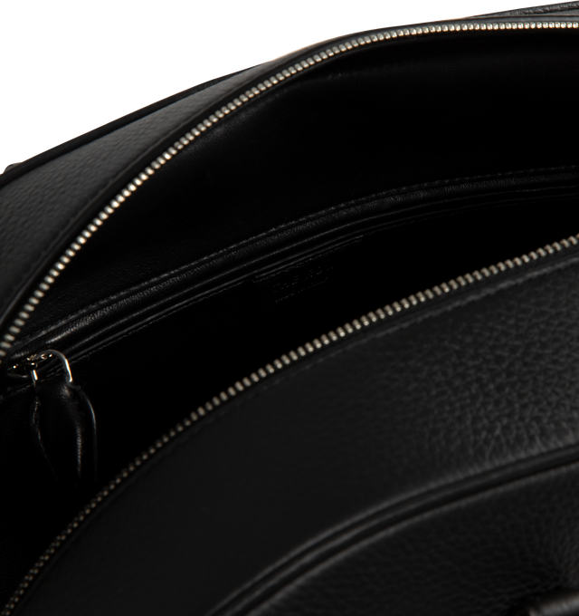 Image 3 of 3 - BLACK - The Row India 15.75 Updated bowling bag in textured calfskin leather with tubular handles, branded metal padlock and key, and zipper closure. Measures 15.35 x 10.24 x 5.51 inches with 6.30 inch handle drop. 100% Calfskin Leather. Lined in 100% Leather. Made in Italy. 