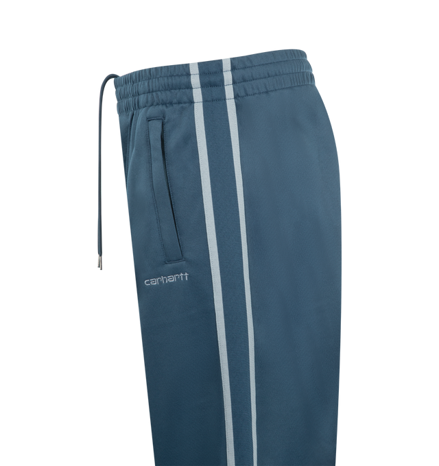 Image 3 of 3 - BLUE - CARHARTT WIP  Bolar Sweat Pant featuring a loose fit, midweight, unbrushed polycotton jersey, knitted tape detailing on each leg, zipped pockets on the front and back and an embroidered Script Logo. 64% polyester, 36% cotton. 