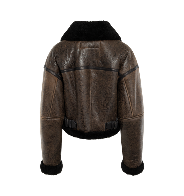 Image 2 of 2 - BROWN - ACNE STUDIOS Shearling Jacket featuring crackled finish leather, relaxed fit, waist length, shirt collar, zipper closure, front welt pockets and adjustable straps at the neck. 100% lamb shearling. 