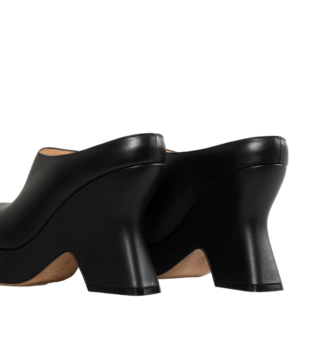 BLACK - LOEWE Wedge Clogs has a orund toe, scultped 110cm covered heel, and platform sole.  Calfskin leather. made in Italy. 